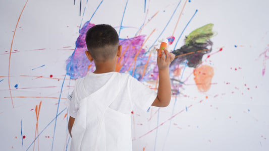 kid painting a wall