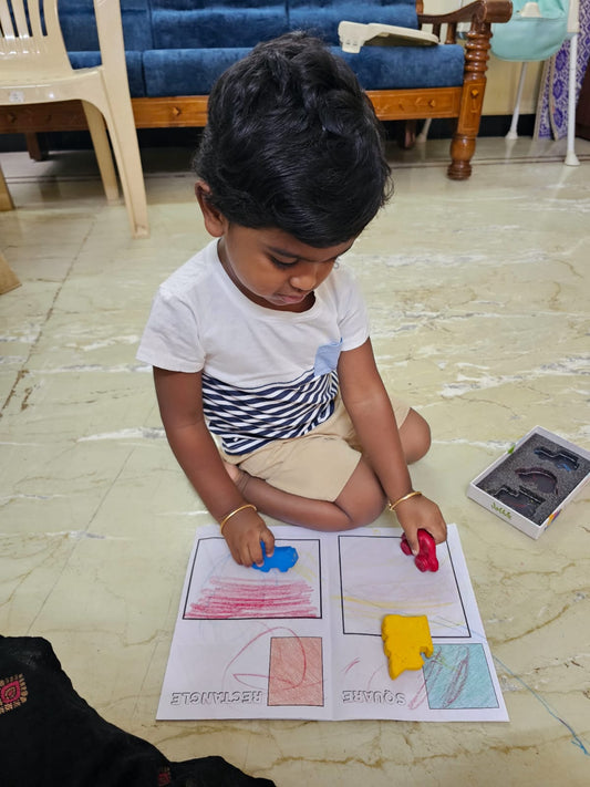 Kid is coloring using safe and non toxic crayons