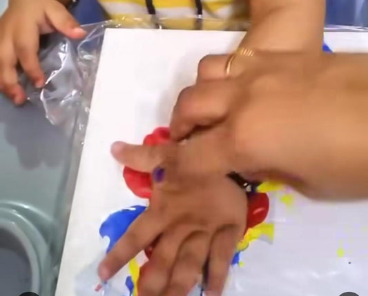 Kid Dabbing on canvas to create art